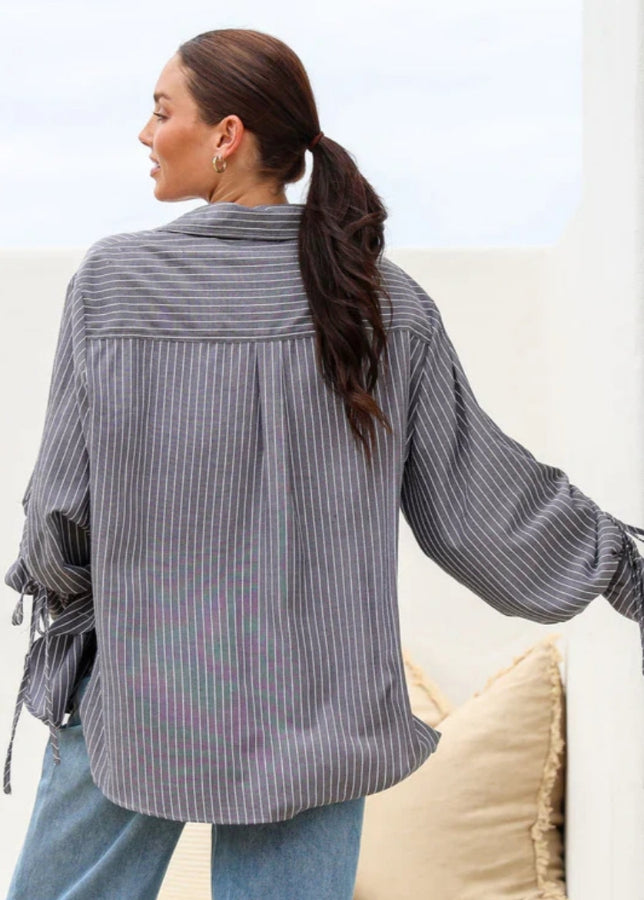 Close-up of striped fabric and sleeve ties on Billie Shirt