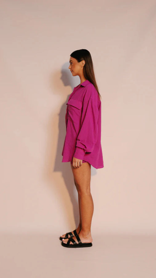 Model wearing magenta Rosette Shirt with oversized fit and button-down front from Vivian The Store.