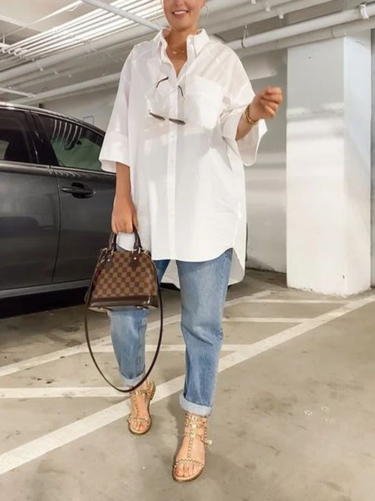 model wearing white long sleeve shirt with denim jeans
